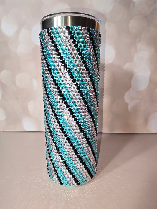 20oz skinny tumbler fully covered in teal, clear, and black rhinestones in a zebra stripe pattern
