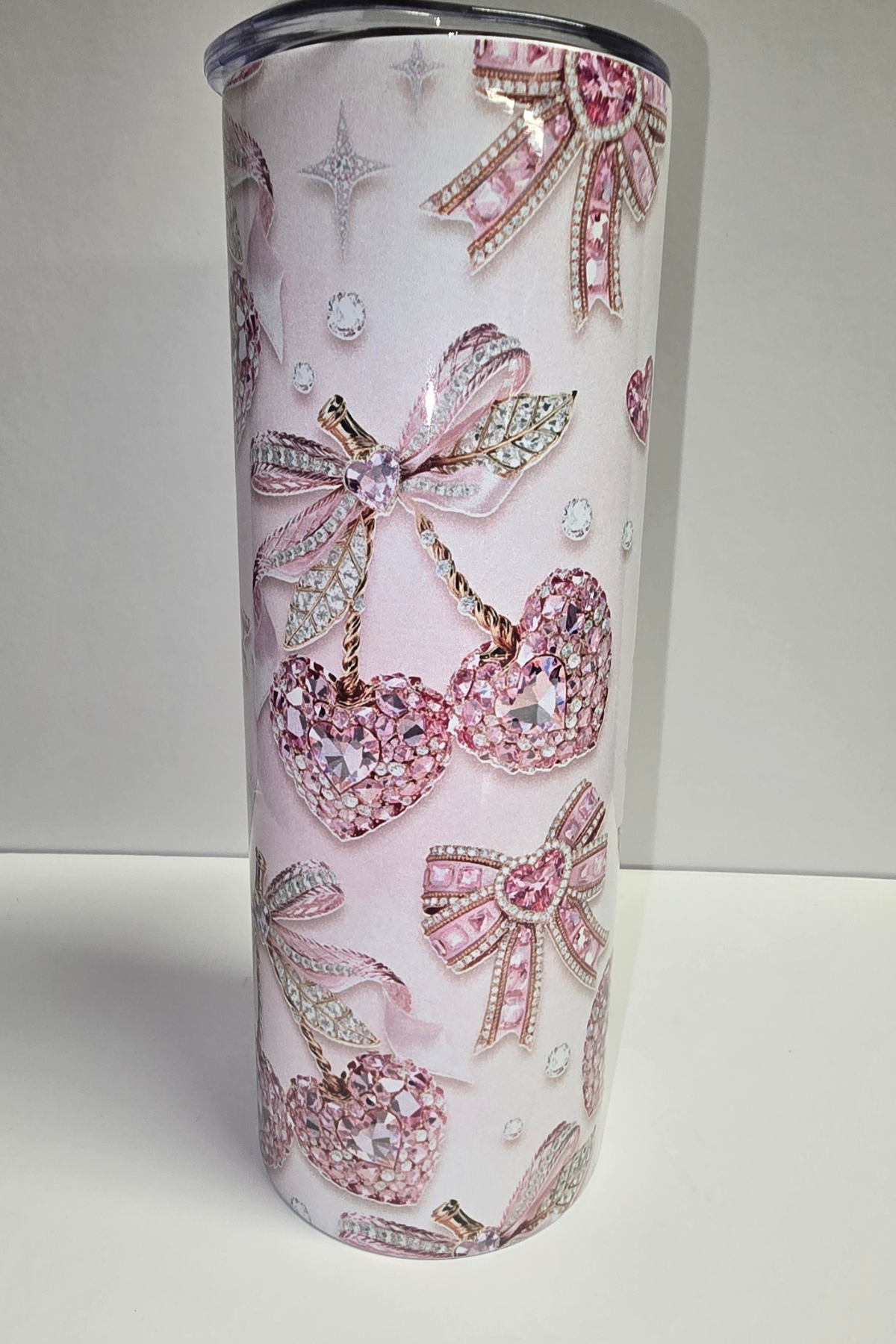 Rhinestone cherries and bows sublimation tumbler on blush pink background
